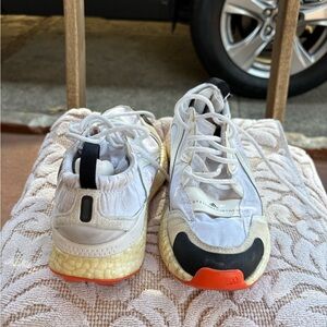 adidas White and Black Athletic Shoes with Orange Accents